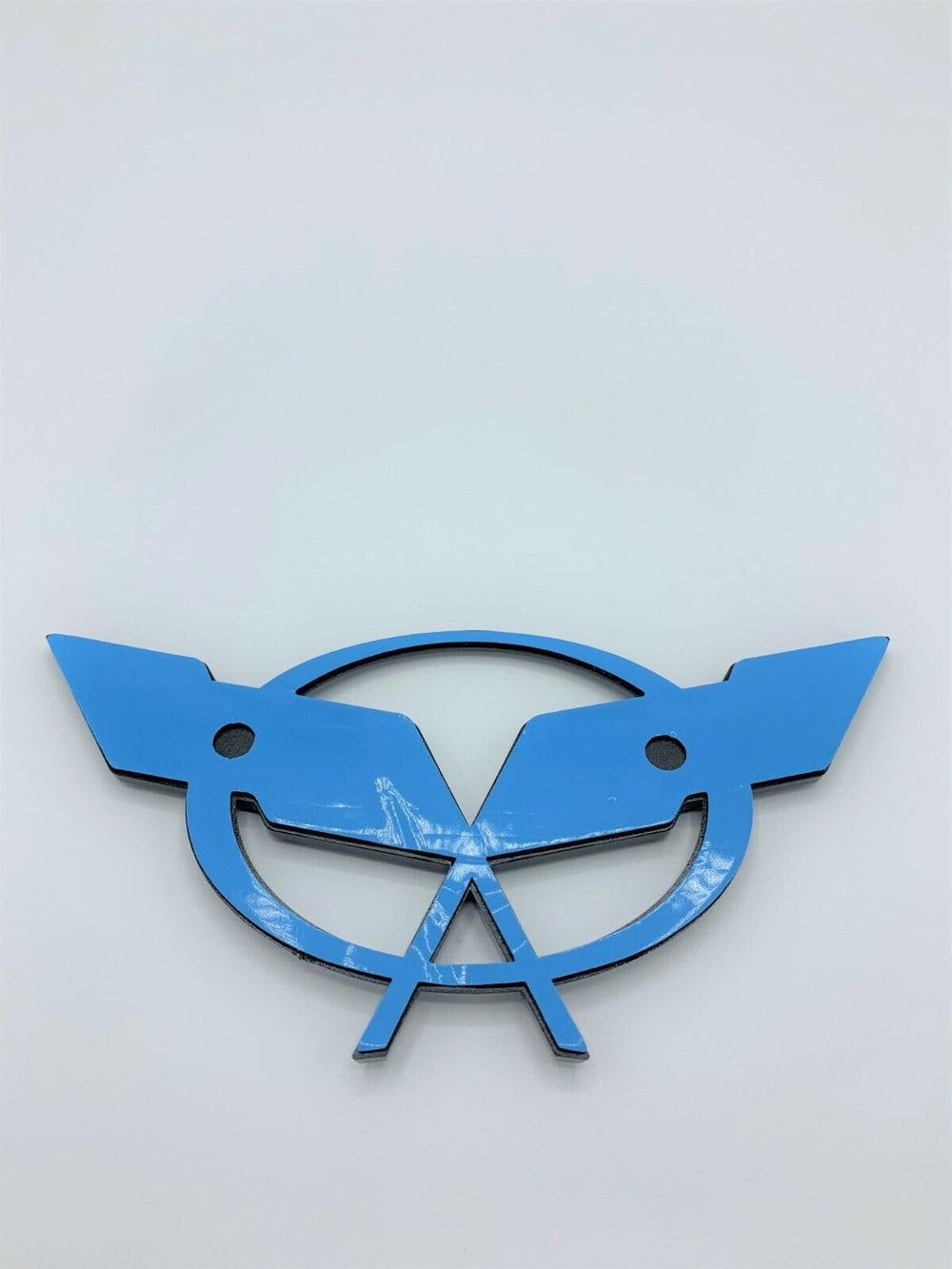 The REIXS C5 deck lid badge is a 3D emblem for an OEM-style upgrade.