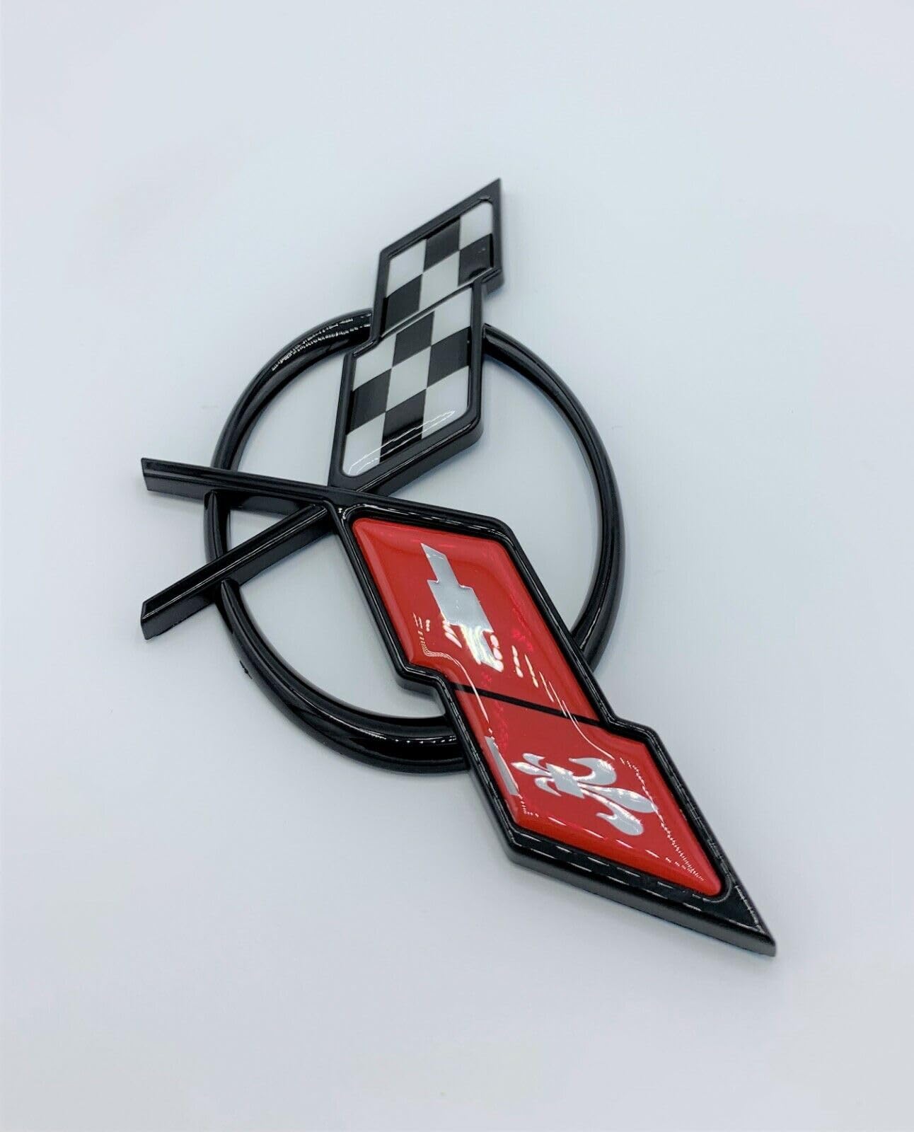 REIXS waterproof and fade-resistant emblem, built for outdoor driving.
