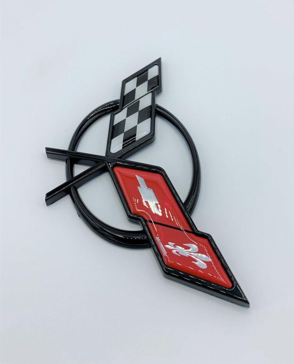 REIXS waterproof and fade-resistant emblem, built for outdoor driving.