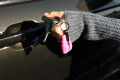 RESQME seatbelt cutter close-up with razor-sharp blade for rapid release