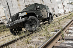 Rough Country 2.5-inch lift kit bolt-on components laid out for easy at-home installation.