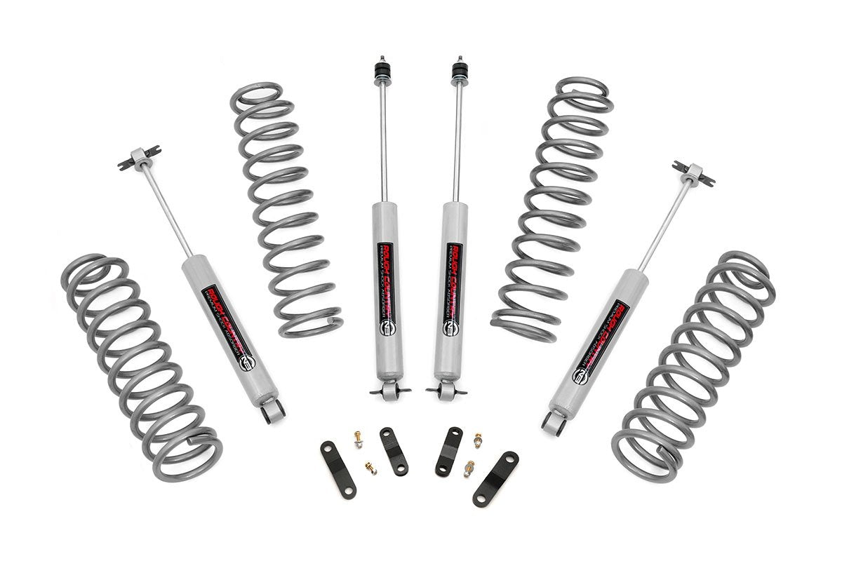 Rough Country 2.5-inch lift kit front coil springs raise JK Unlimited for improved ground clearance.