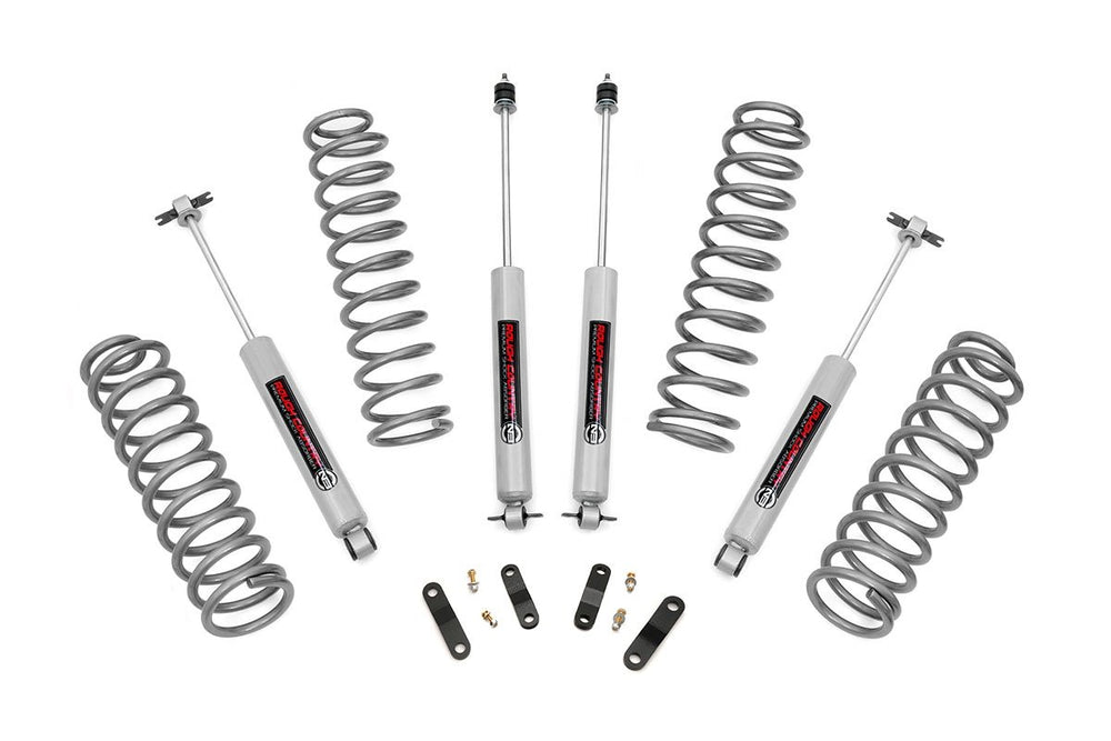 Rough Country 2.5-inch lift kit front coil springs raise JK Unlimited for improved ground clearance.