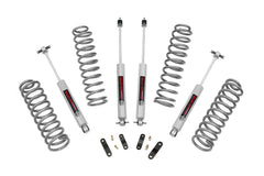 Rough Country 2.5-inch lift kit front coil springs raise JK Unlimited for improved ground clearance.