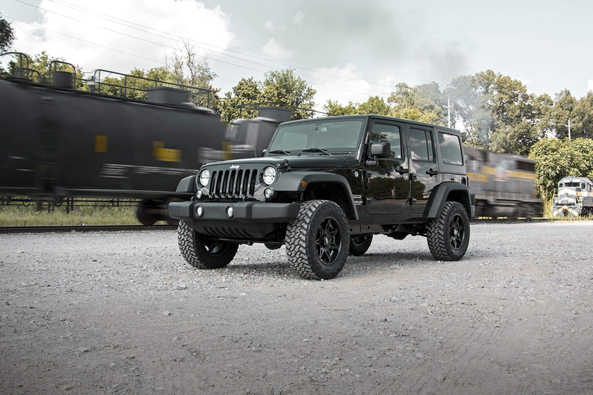Rough Country 2.5-inch lift kit installed on a Jeep Wrangler JK Unlimited for off-road confidence.