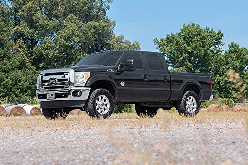 Bolt-on installation sequence for Rough Country 2in leveling kit in a home garage