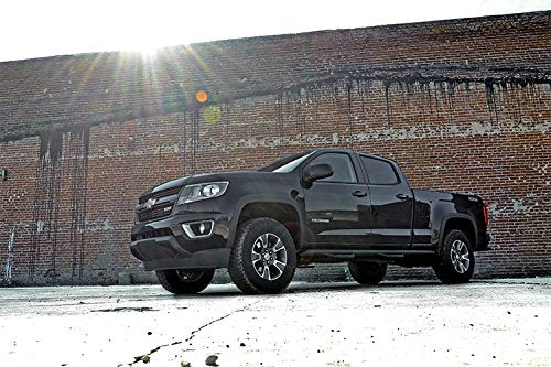 Rough Country 2in Leveling Kit rear spacer with factory wheels demonstrating level stance