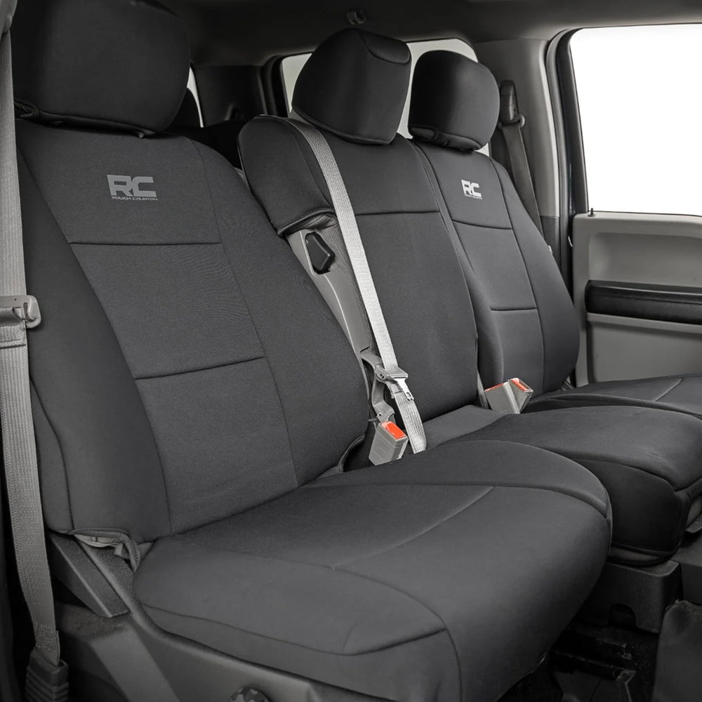 Rough Country neoprene front seat cover on Ford F-150 highlights spill protection.
