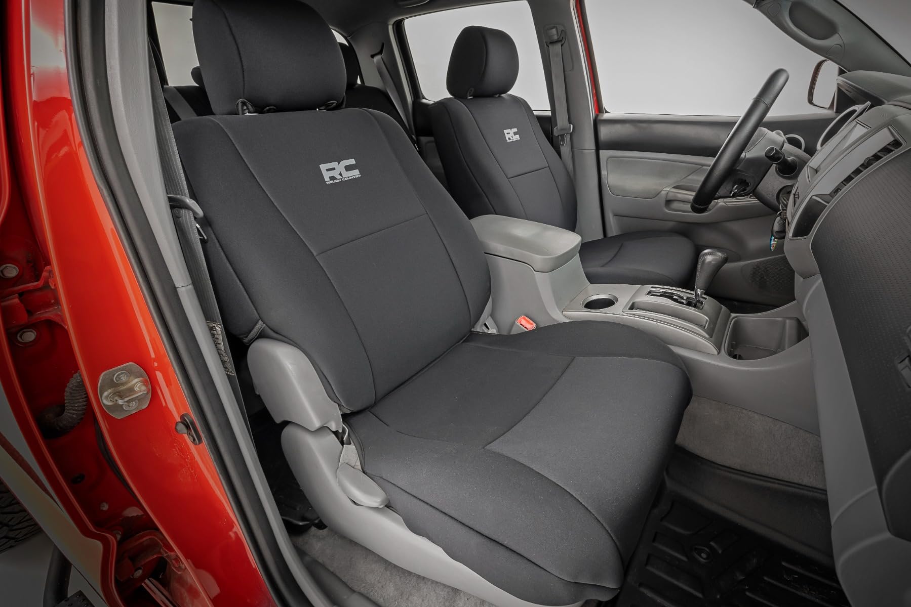 Rough Country factory-fit neoprene seat covers blend with Tacoma interior.