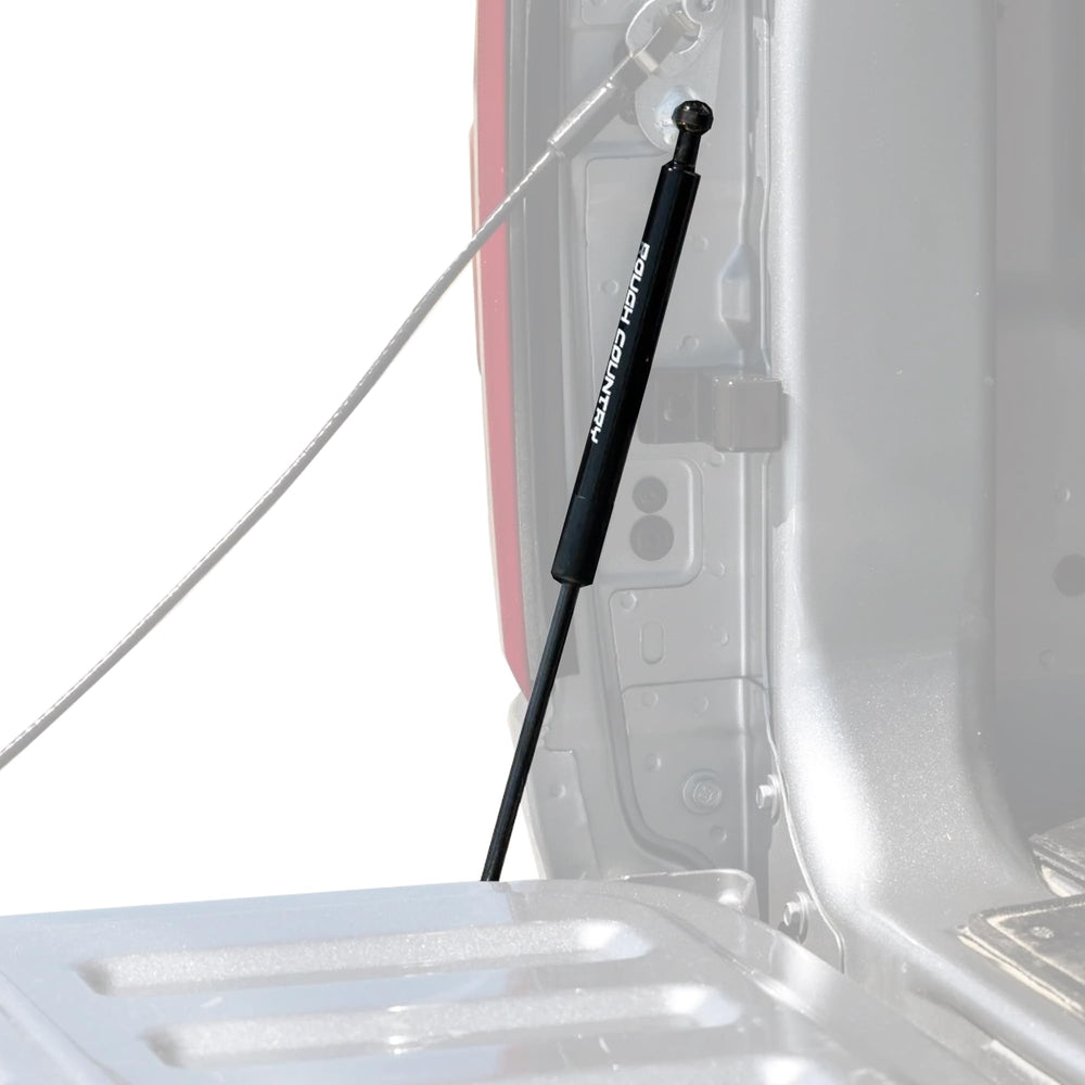 Rough Country tailgate assist mounted on Ram 1500 with driver-side pull handle for safe lowering