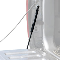 Rough Country tailgate assist mounted on Ram 1500 with driver-side pull handle for safe lowering