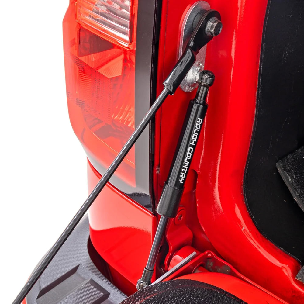 Rough Country Tailgate Assist drops smoothly for safe one-handed access to the truck bed.