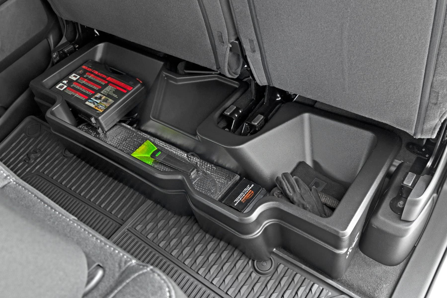 Rough Country under-seat storage in Ram 1500 Crew Cab, side view showing compact integration.