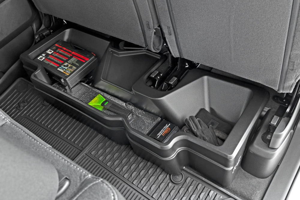 Rough Country under-seat storage in Ram 1500 Crew Cab, side view showing compact integration.