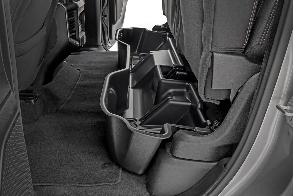 Rough Country under-seat storage for Ram 1500 Quad Cab keeps tools organized under the rear seat.