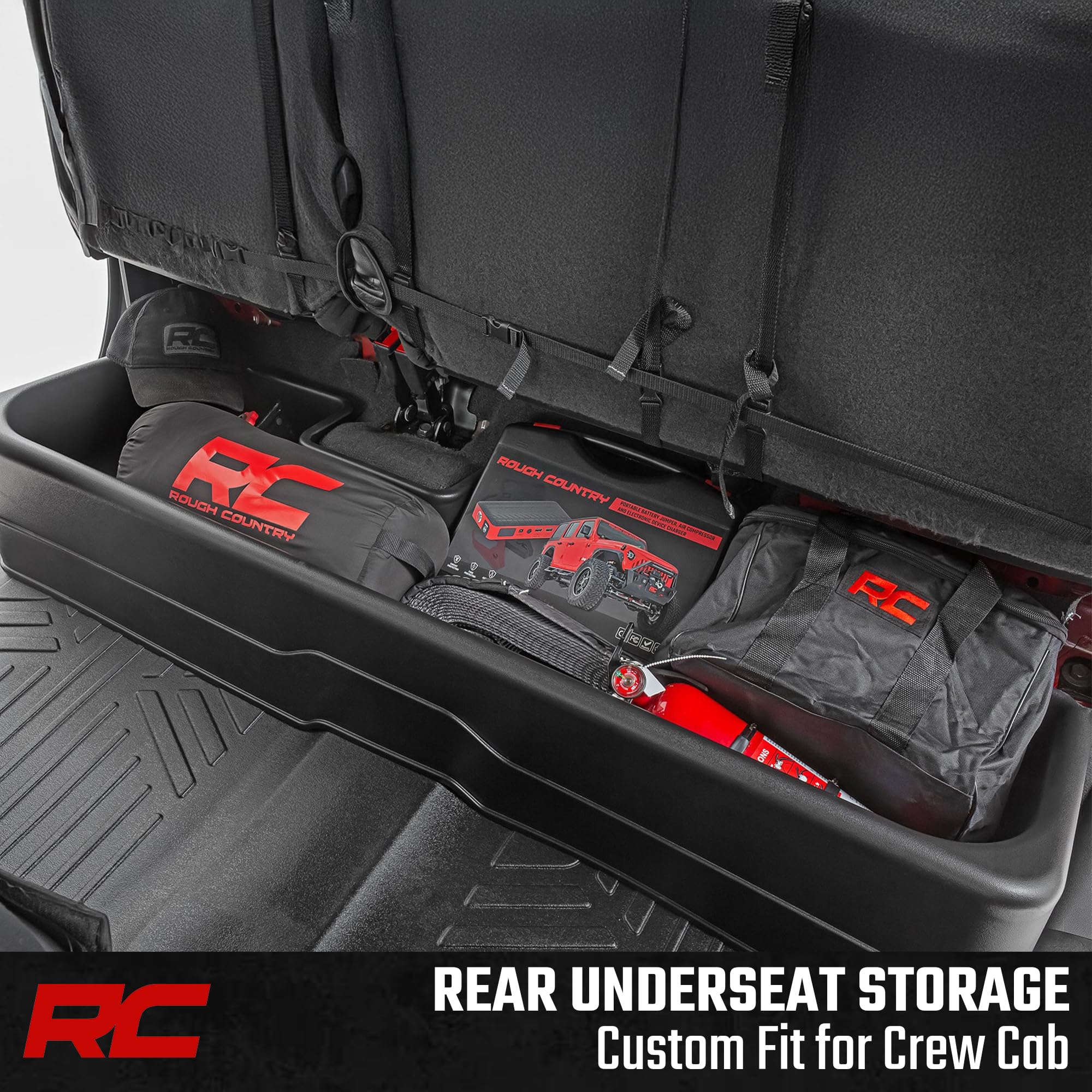 Rough Country under-seat storage holds tools and gear securely under the rear seat.