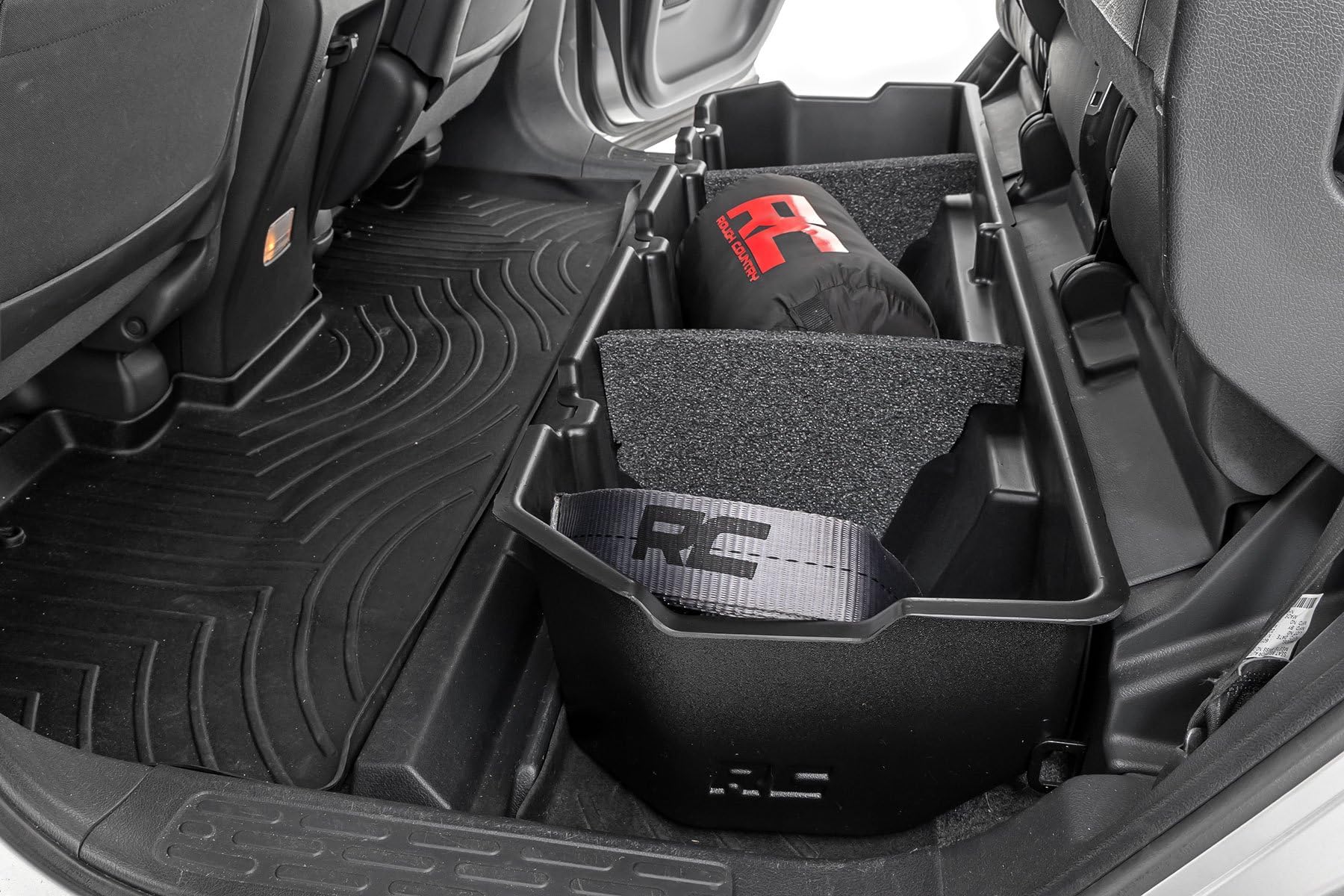 Rough Country under-seat storage for Honda Ridgeline demonstrates a contoured fit that keeps gear neatly organized.