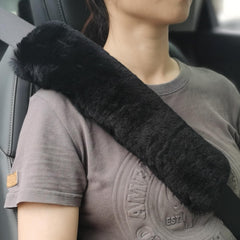 ROYAGO soft sheepskin seat belt pad in black for comfortable driving.