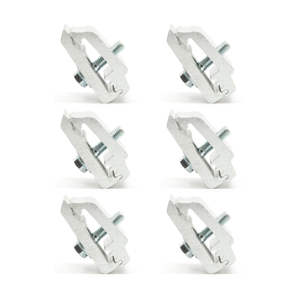 RuggedXL Low Pro aluminum mounting clamps securing camper to truck bed for stability