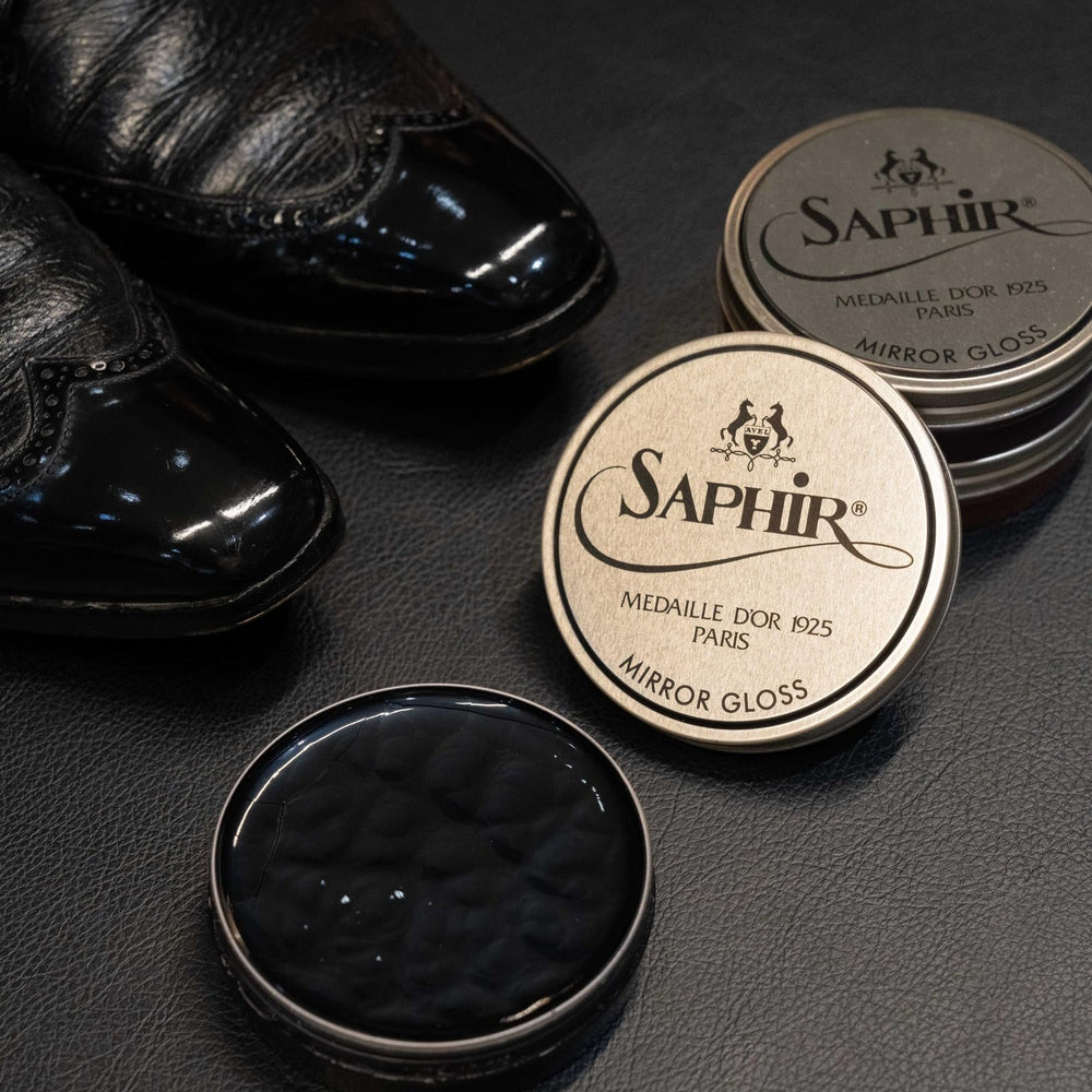 SAPHIR Medaille d’Or bag being polished for renewed luster.