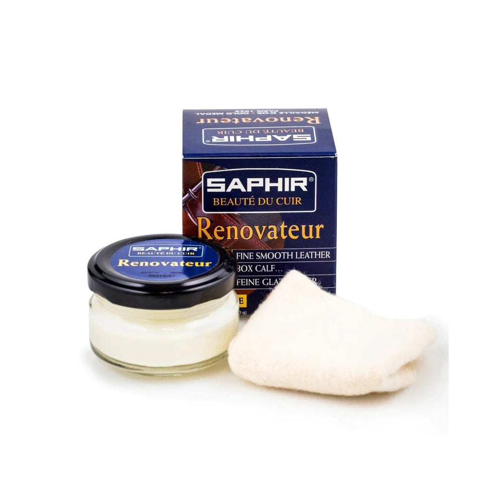 SAPHIR Renovator bottle with included chamois for easy leather care.