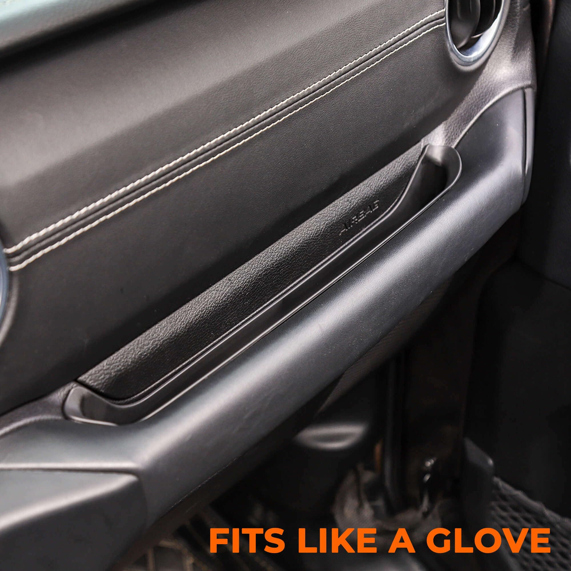 Durable black ABS GrabTray blends with cabin aesthetics and adds storage.