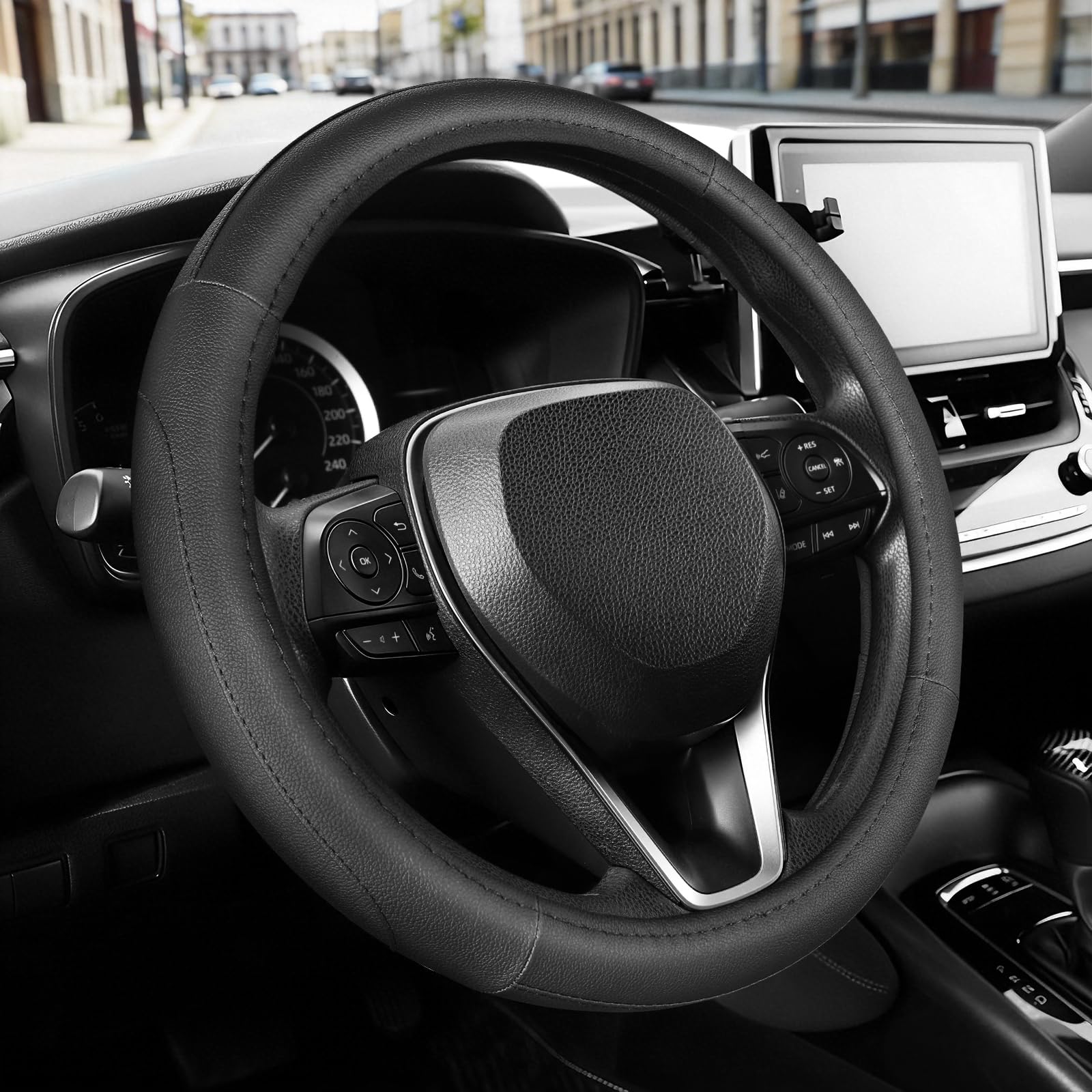 SEG Direct steering wheel cover in black microfiber leather improves grip on 14-14-25 inch wheels.