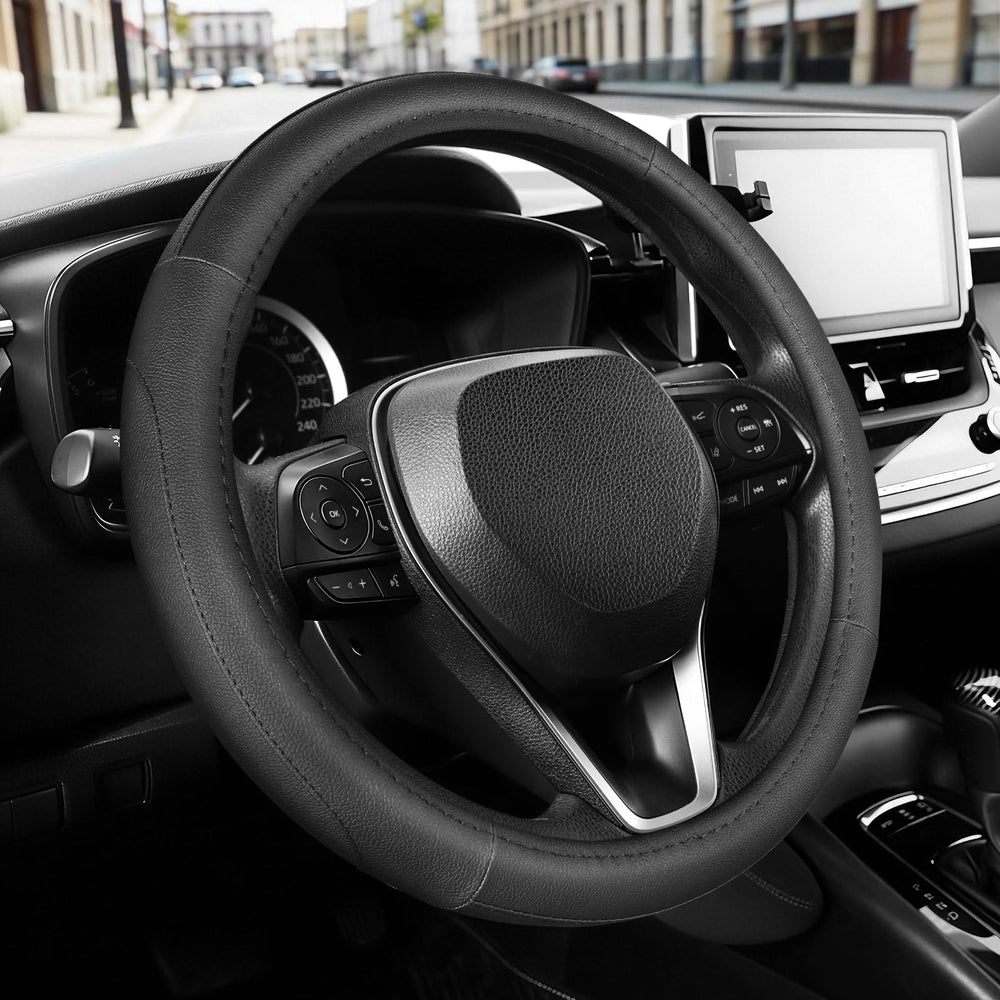 SEG Direct steering wheel cover in black microfiber leather improves grip on 14-14-25 inch wheels.