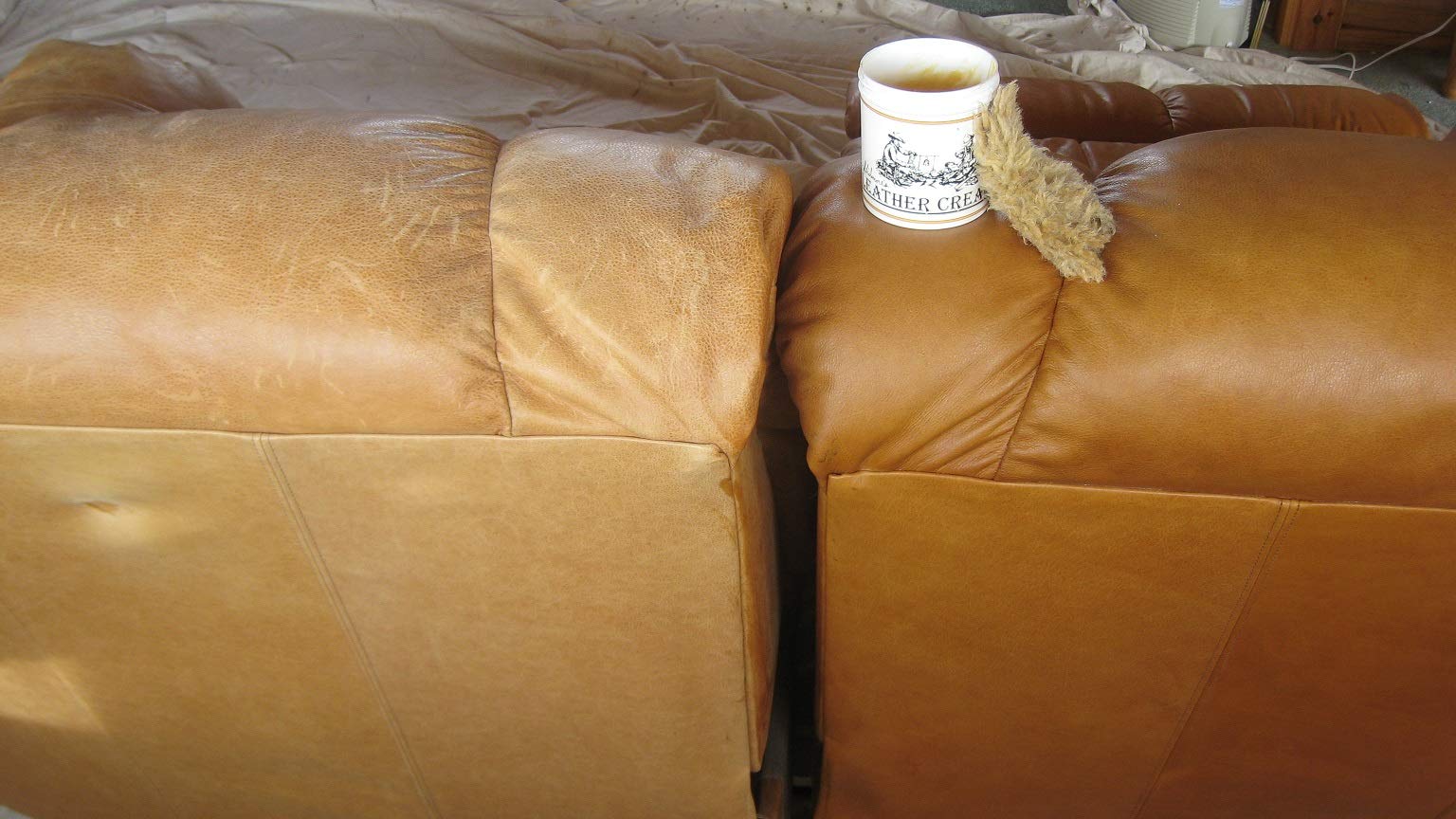 Skidmore's Leather Cream on car seat revives color and protects against wear.