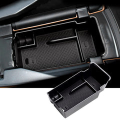 SKTU Envision console organizer with coins and sunglasses keeps essentials within reach.
