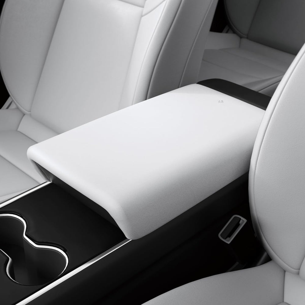 Spigen center console armrest cover on Tesla Model Y front view protects interior surfaces.