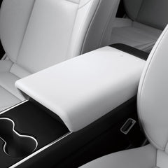 Spigen center console armrest cover on Tesla Model Y front view protects interior surfaces.