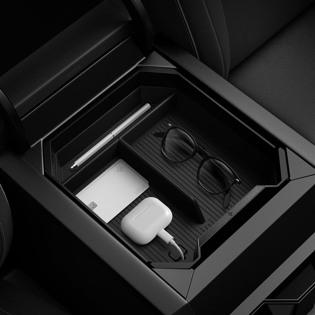 Spigen center-console-organizer for Tesla Cybertruck carbon edition keeps essentials within easy reach.