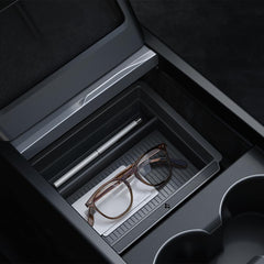 Spigen center console organizer for Tesla Model Y Juniper, sliding view, keeps essentials neatly accessible.