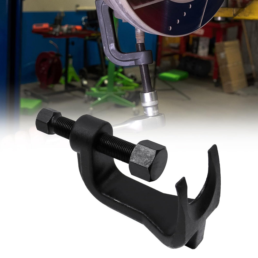 Sporacingrts ball joint separator in use to safely pry apart a ball joint.