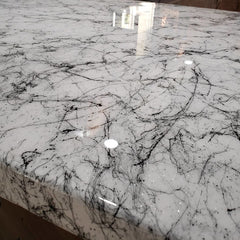 Stone Coat Countertops crystal-clear polish applied to a glossy epoxy finish