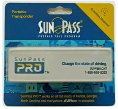 Sunpass Bluenin transponder inside windshield enables automatic toll deductions in Florida.