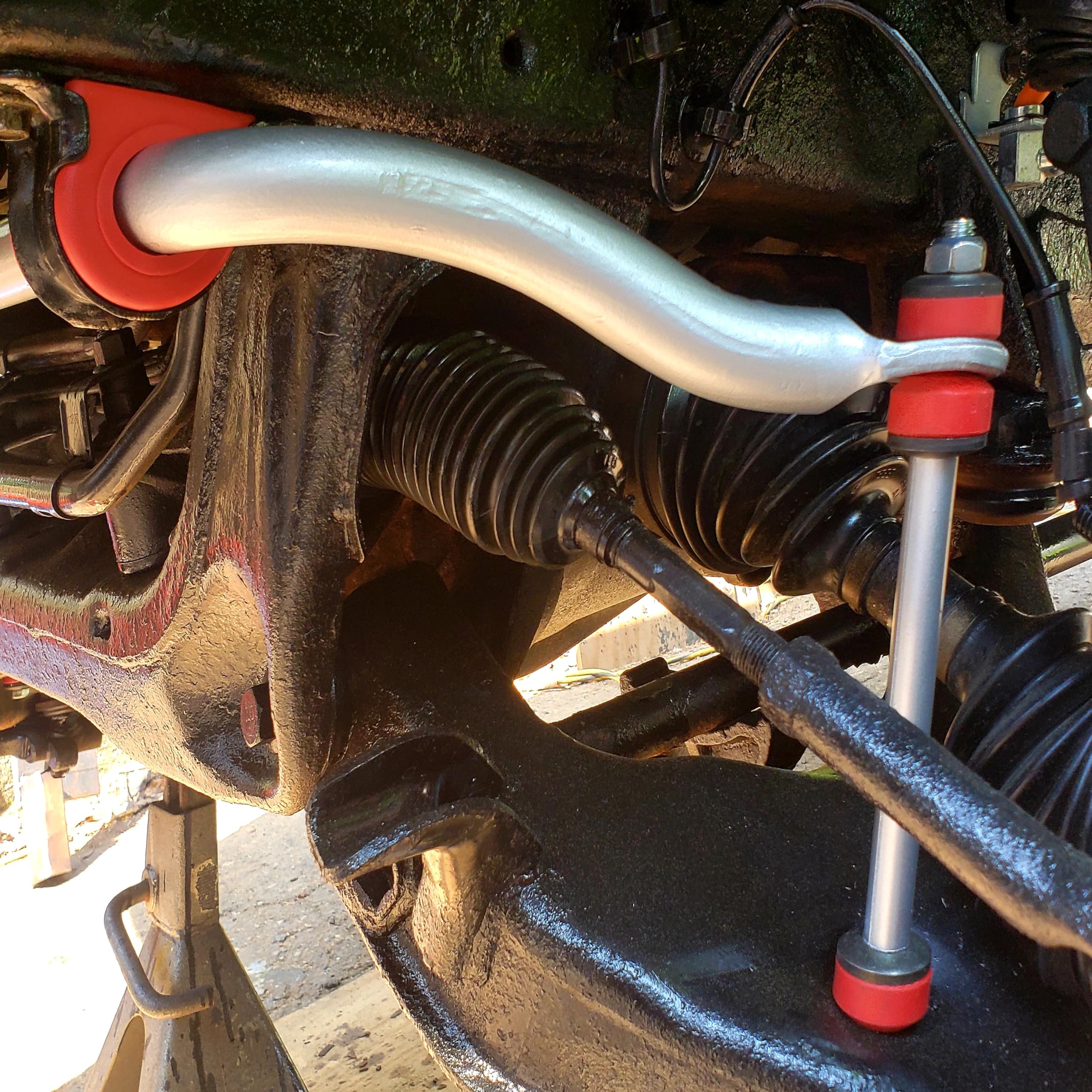 Suspension Dudes Code Red bushings close-up shows durable polyurethane construction.