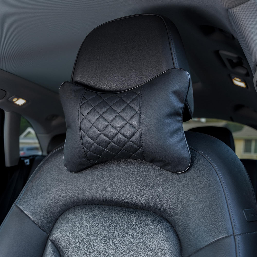 Synterior quilted headrest pair in car offers coordinated style and enhanced neck support.