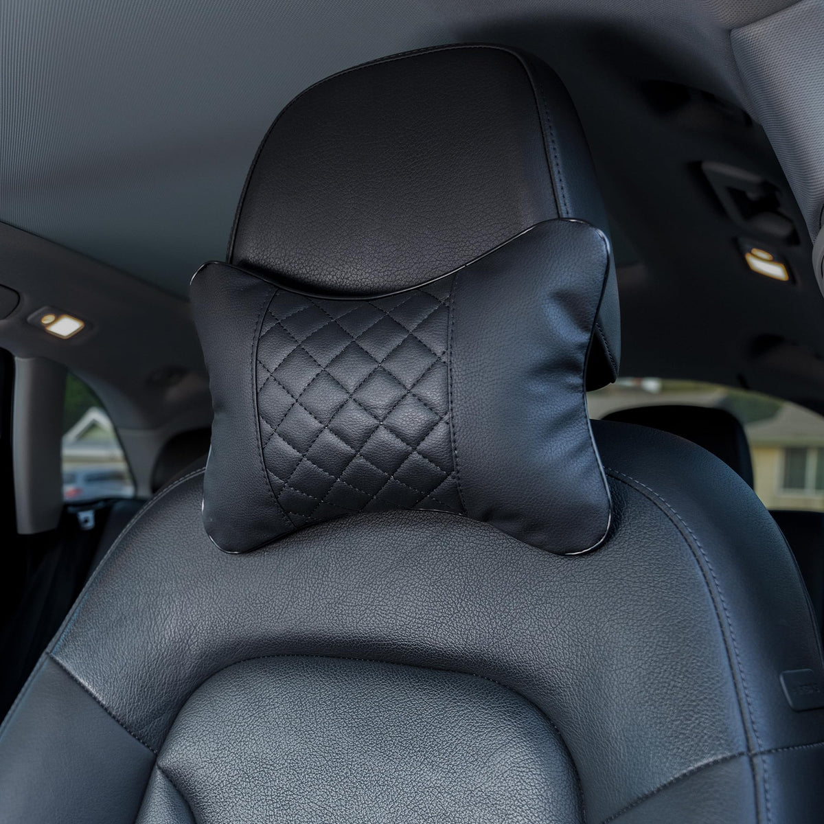 Synterior quilted headrest pair in car offers coordinated style and enhanced neck support.