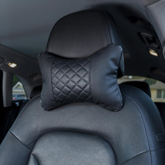 Synterior quilted headrest pair in car offers coordinated style and enhanced neck support.