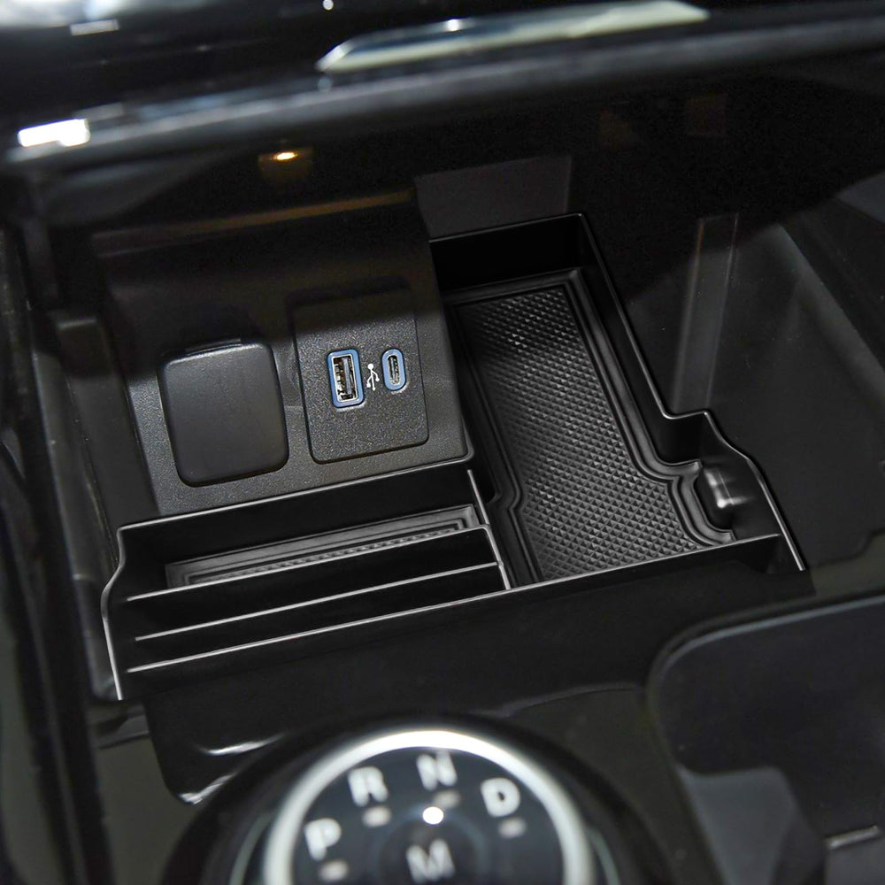 Tray design preserves console port access while keeping cords managed.