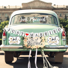 Tallew Just Married magnets with golden borders enhance a romantic car display.