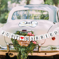 Vinyl Just Married window decals on a smooth car surface for blessings.