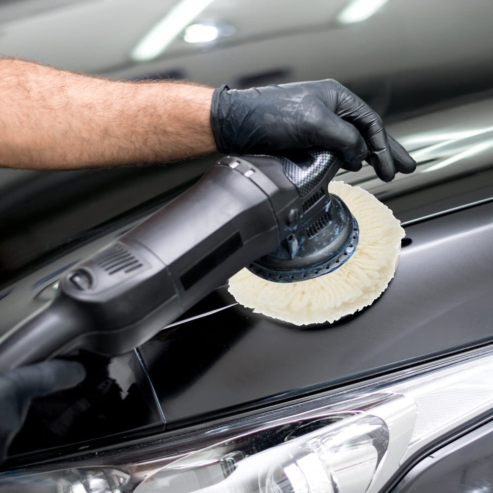 Tallew wool buffing pad on car body for oxidized paint removal
