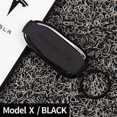 Tesla Gear Model X key fob cover side view with secure grip.
