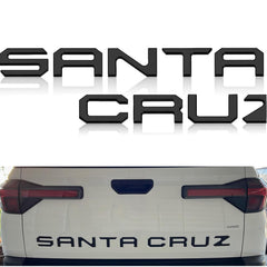 Texflic tailgate letters on Hyundai Santa Cruz, matte black emblem adds rugged style.