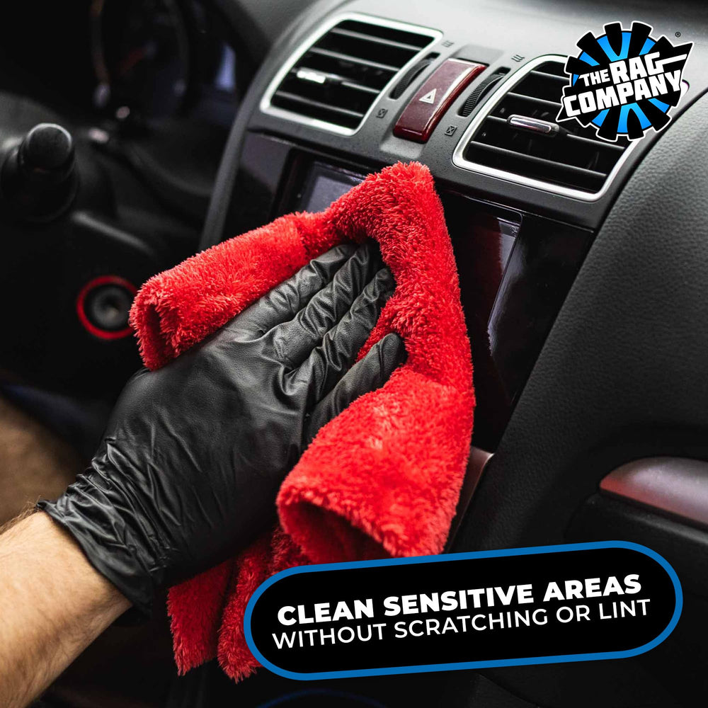 The Rag Company Eagle Edgeless 500 red towels in use on a vehicle panel.