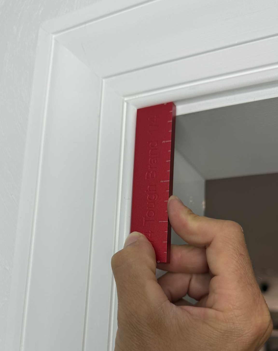 Measuring doors, windows, and trim with The Tough Brand tool