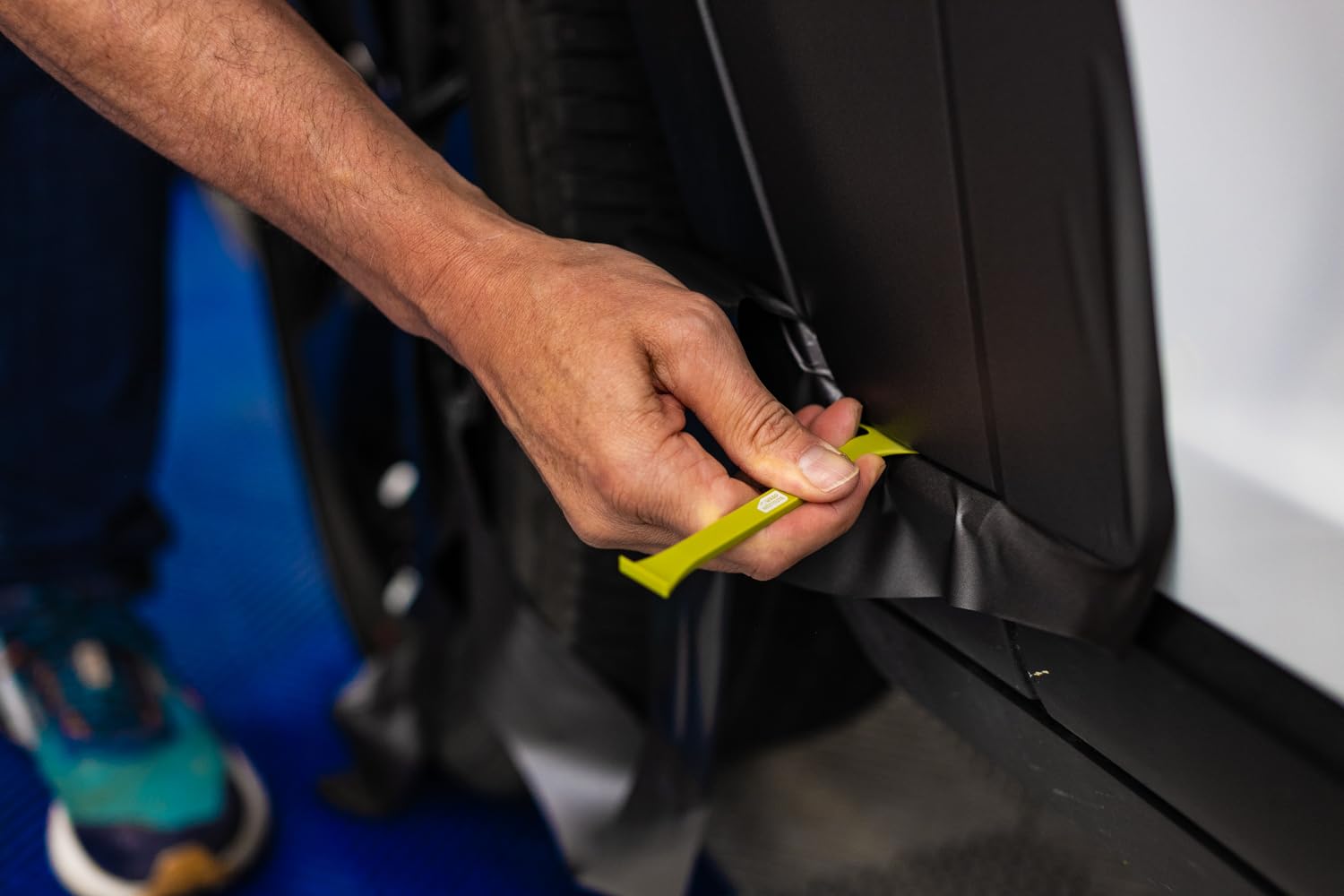 The Wrap Institute red double-axe edge close-up enables precise, safe cuts near curves.